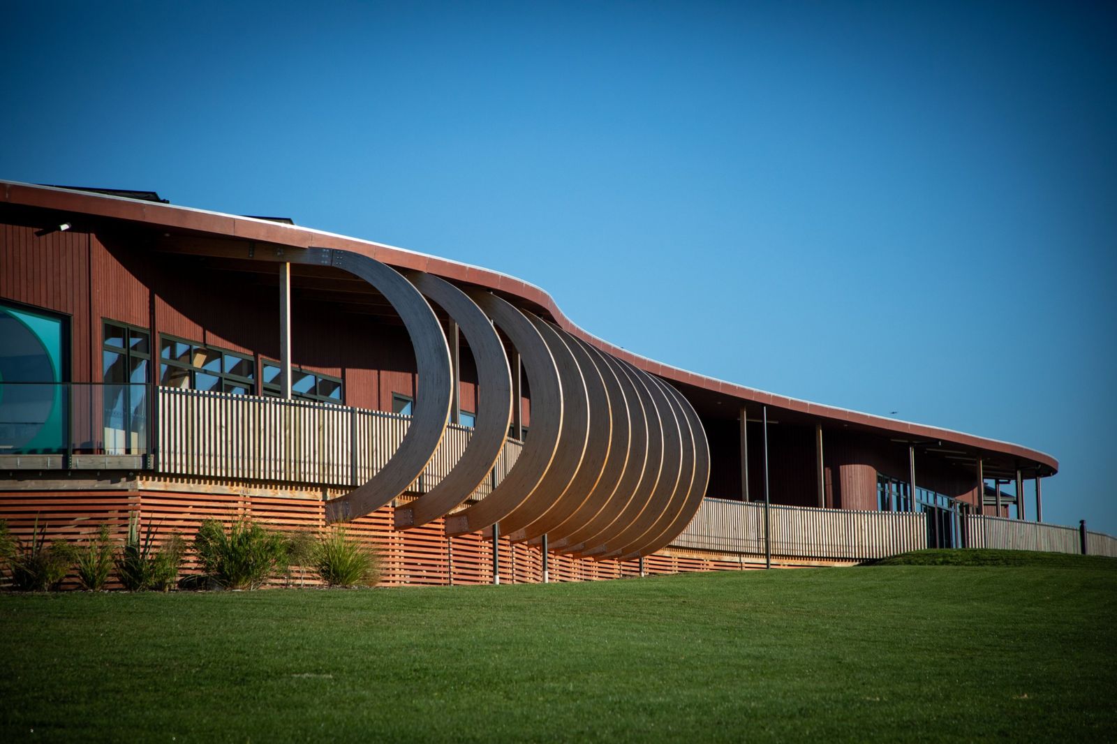 Curved timber arches along the marae