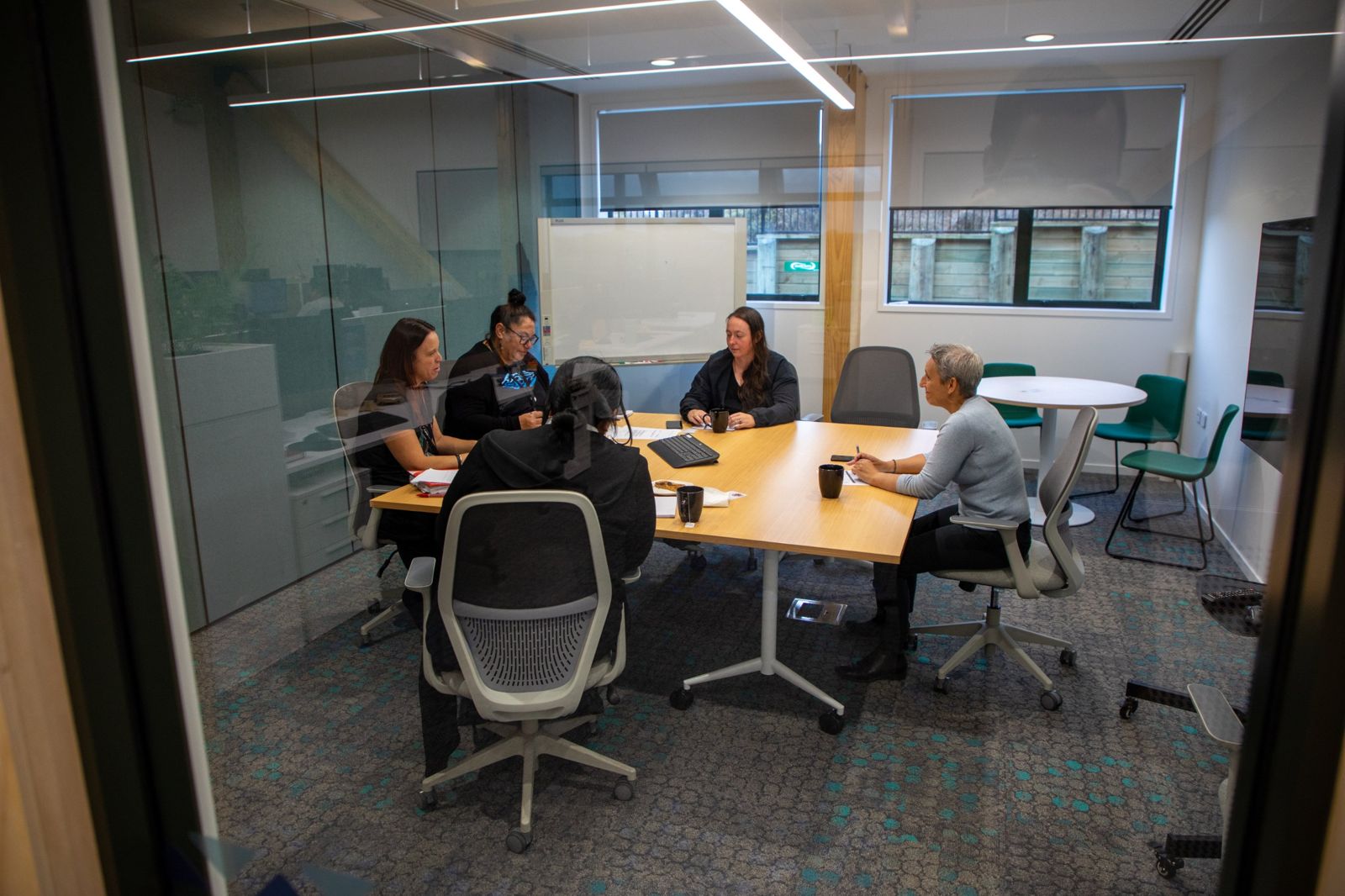A group working together around a meeting table