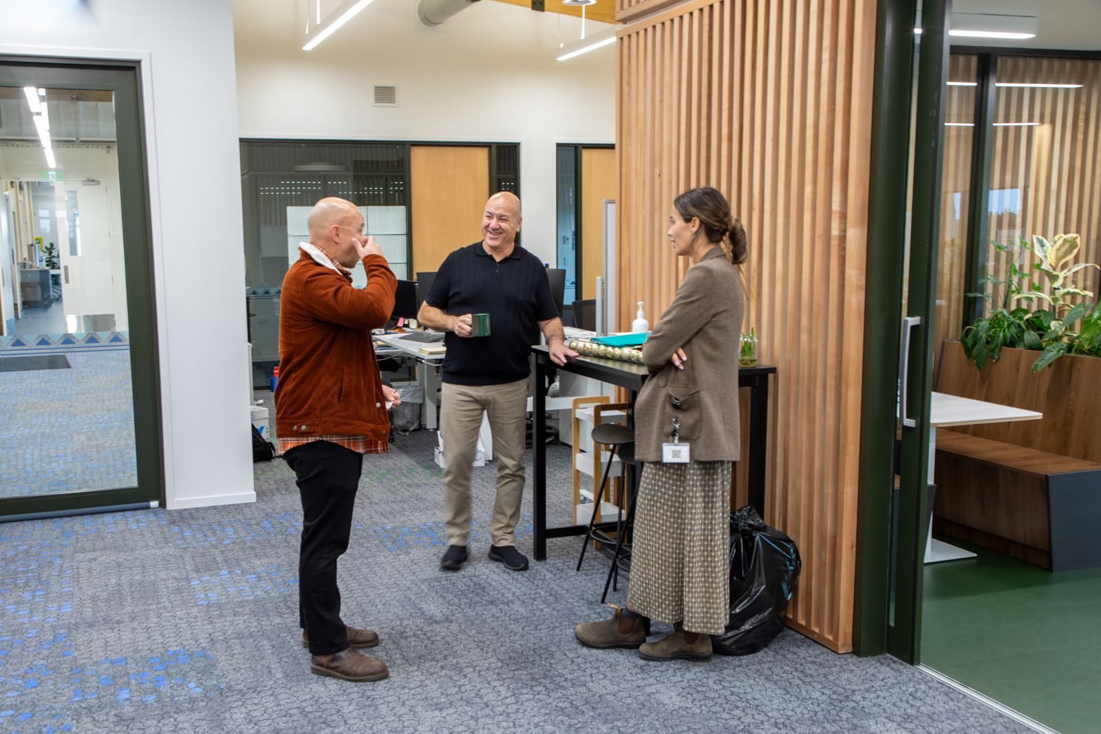 Kaimahi sharing a laugh in the office